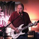 Mike Cowell – Lead vocals, various guitars, harmonica, percussion