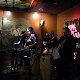 Greg Bush (center in the back) - Bass Mark Toelkes (right) - Lead Vocals, Guitar and Percussion